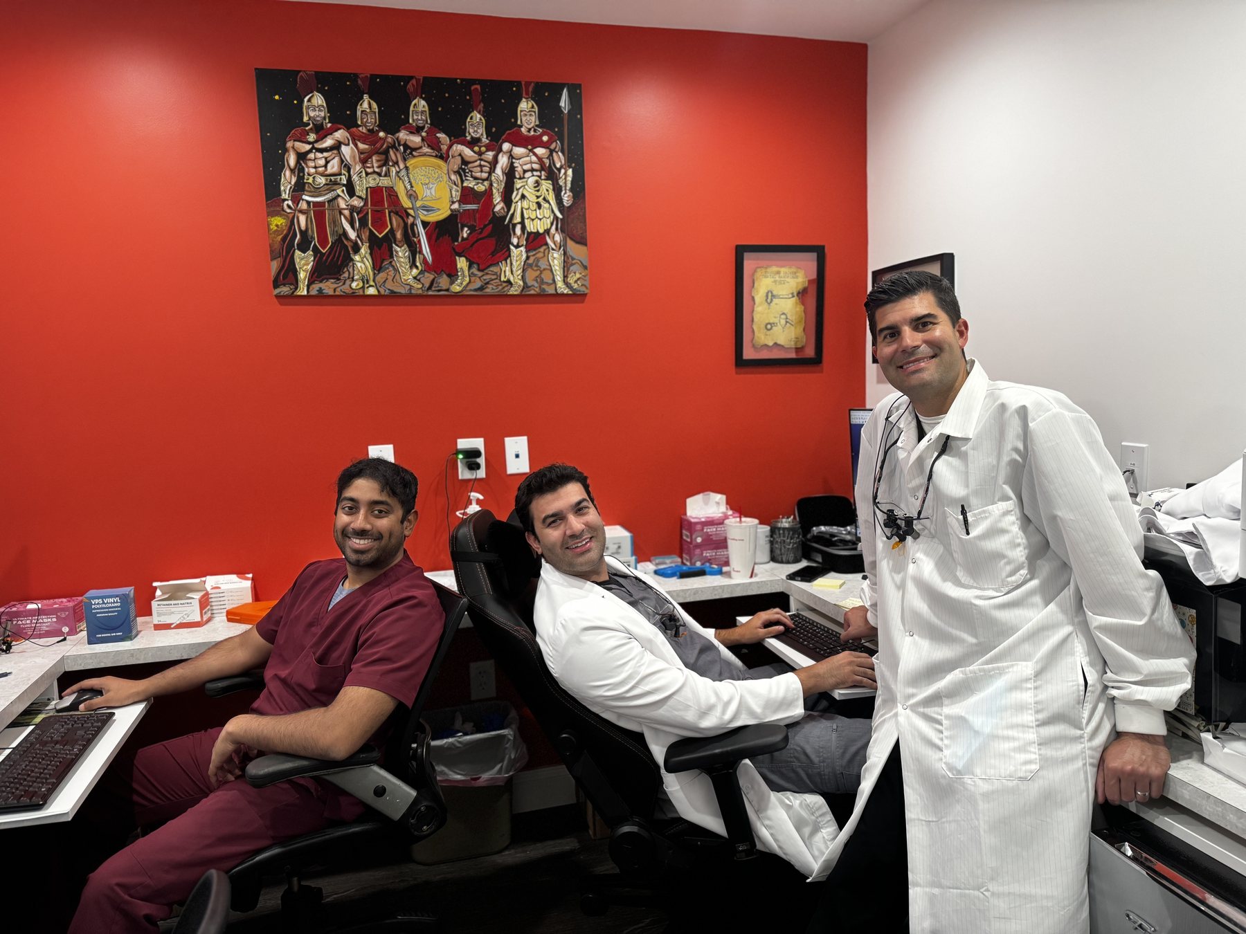 Three Parkville Family Dentistry doctors relaxing together in the office