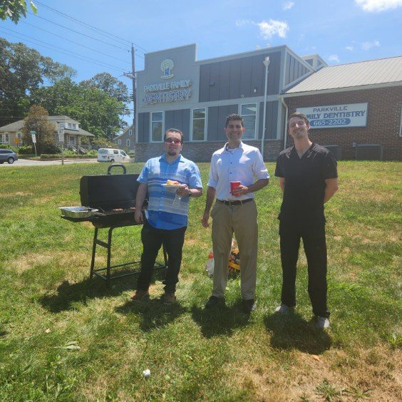 Parkville Family Dentistry team members grilling outdoors at a picnic
