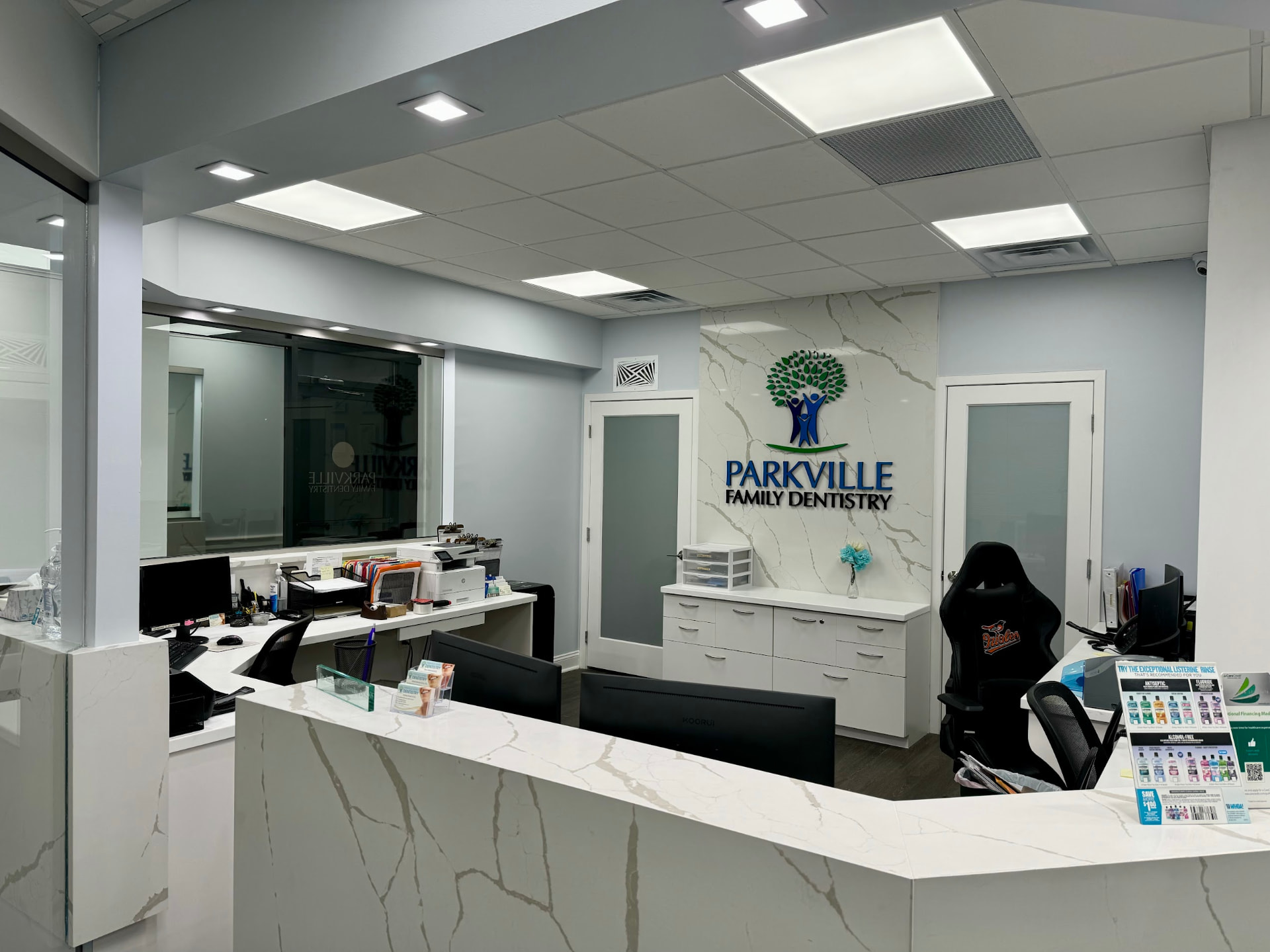 Front office with the Parkville Family Dentistry logo wall