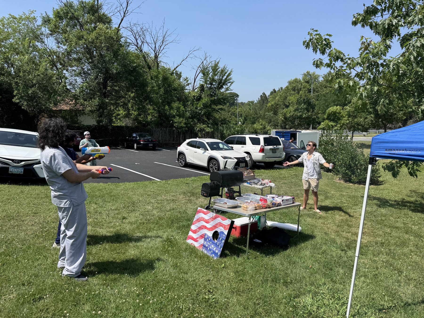 Parkville Family Dentistry team enjoying a summer water fight outdoors